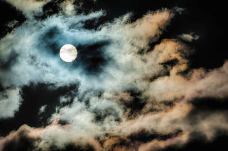 Clouds light up by the sun through multiple filters.