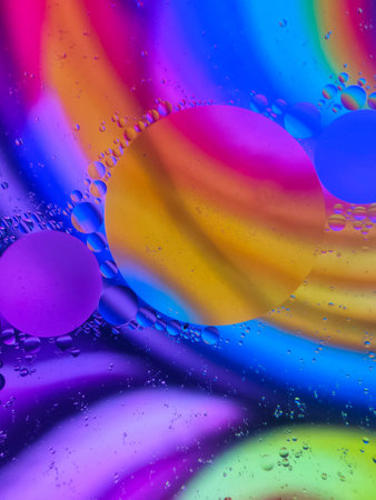 abstract colorful background with oil drops and water droplets on water surface