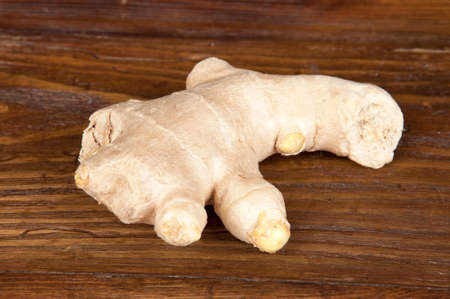 rhizome of ginger and spices on wooden table