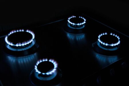 gas stove with blue fireの写真素材