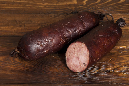 kind of sausage - wooden backgroundの写真素材