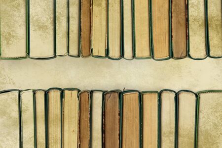 books in a row on old paperの写真素材