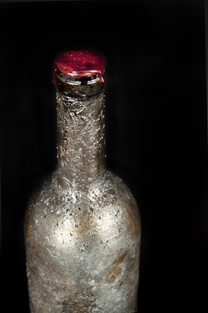 old wine bottle on black backgroundの写真素材