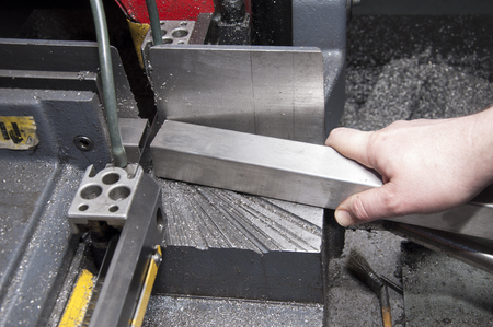 industrial hacksaw in metal workshopの写真素材