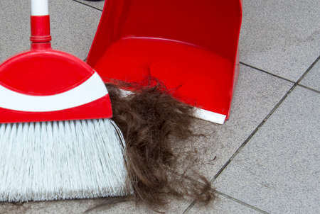 Barbershop. Sweeping hair after cutting