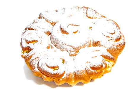 sweet bun with powdered sugar on a light backgroundの写真素材