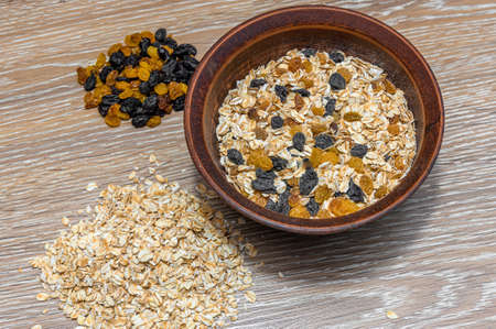 Cooking oatmeal with raisins. Oatmeal with raisins. Diet.