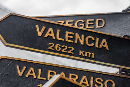 Signpost to the direction of the city of Valencia. The pointer is near the post office.の写真素材