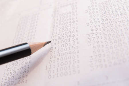 Pencil points to numbers printed on office paper. Accounting concept. Accounting.