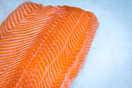 Fresh salmon steak on ice. Chilled red fish