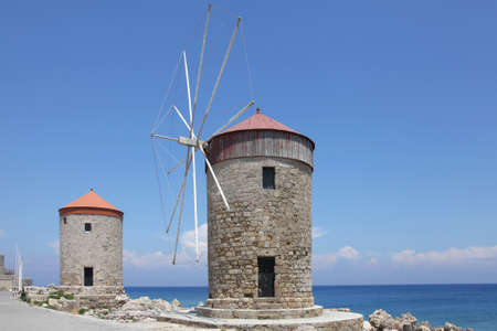 windmills on the Mandraki harbor of Rhodes, Greece の写真素材