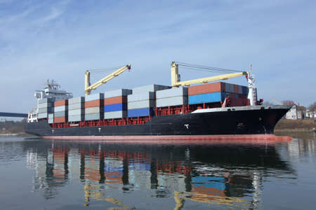 loaded container ship with cranes