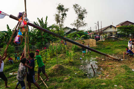 Jakarta, Indonesia - August 17, 2018: the youths are collaborating to establish areca nut on Indonesia's independence dayのeditorial素材
