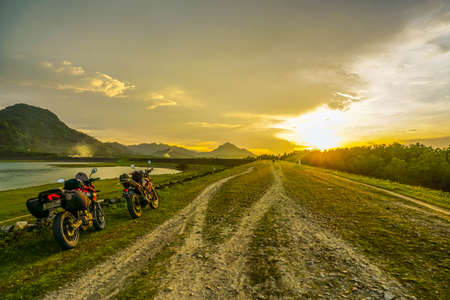 Purwakarta, West Java, Indonesia (03/30/2018) : The rider is touring with his motorcycle through the Jatiluhur Dam side which is commonly called Parang Gombongのeditorial素材
