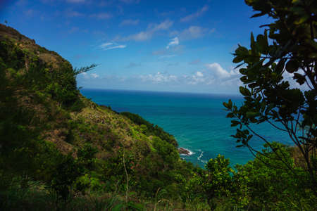 Tropical landscape with steep hill and ocean in the background. Kebumen, Central Java, Indonesia