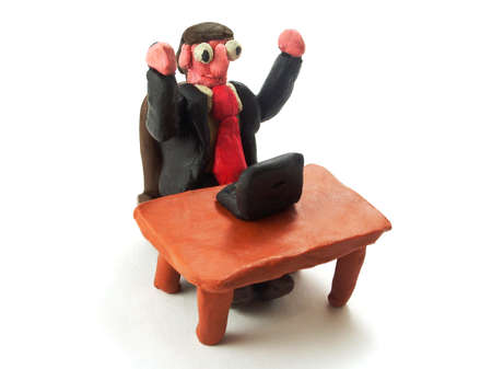 comical plasticine businessman raising hands on a white backgroundの写真素材