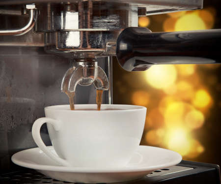 coffee machine preparing cup of coffeeの写真素材