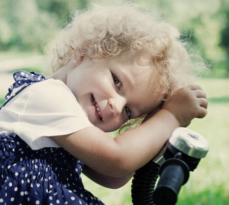 cute little girl in summer parkの写真素材