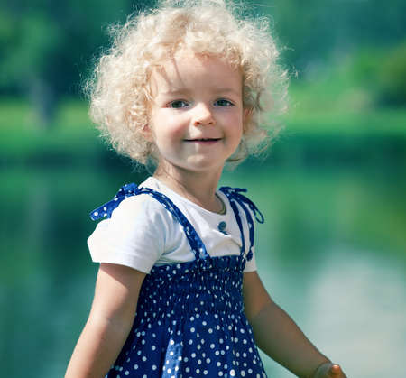 cute little girl in summer parkの写真素材