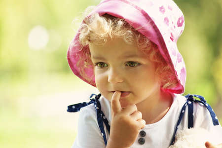 cute little girl in summer sunlightの写真素材