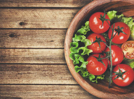 wooden bowl with cherry tomatoes