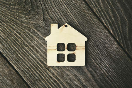 house as symbol on wooden backgroundの写真素材