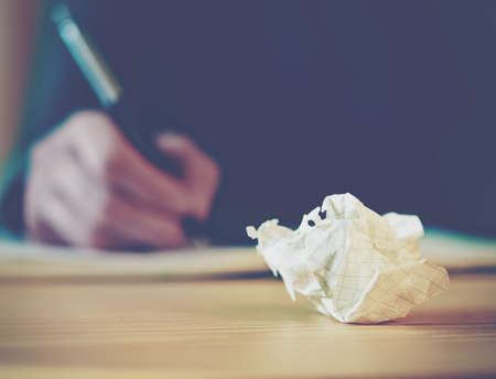 Paper ball during writingの写真素材