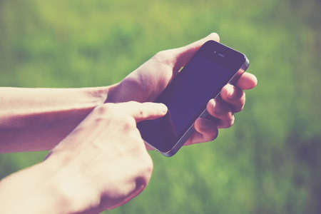 hands using a phone texting on smartphone app