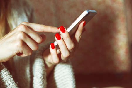 hands with smartphone touching screen and using app hands with smartphone touching screen and using app