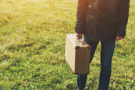 man holding suitcase. space for text or logoの写真素材