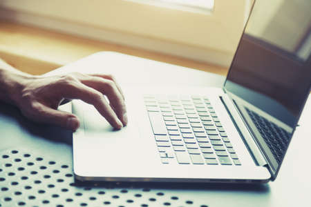 male hand working with laptop