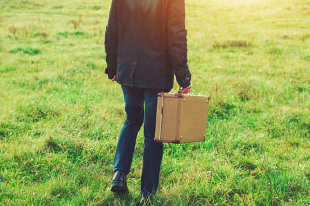 man holding suitcaseの写真素材