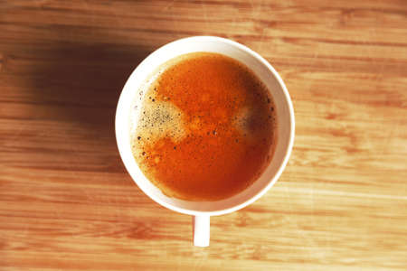 cup of coffee on wooden tableの写真素材