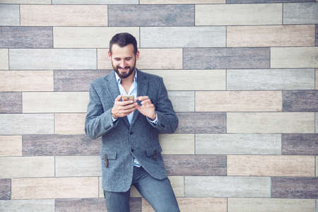 Handsome businessman using smart phone