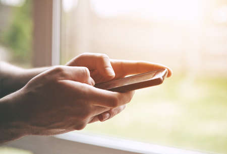 Hands using smart phone touching screen with fingers