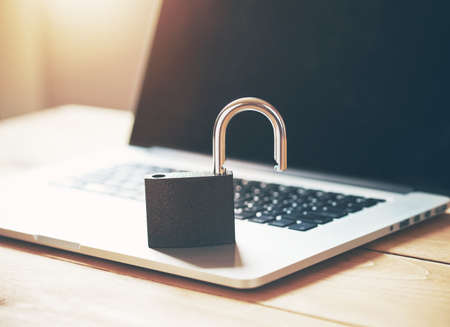 Lock on laptop as computer protection and cyber safety concept. Private data protection from hacker malwareの写真素材