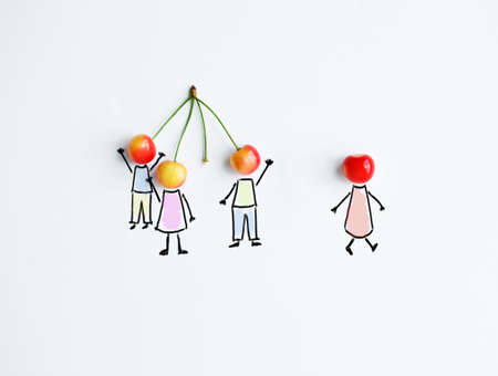 Cherry with hand drawing shapes of team or friends. One is separating from groupの写真素材