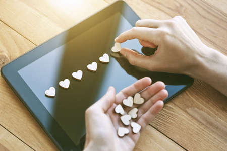 hand giving hearts as like symbol in social media for posts and photos