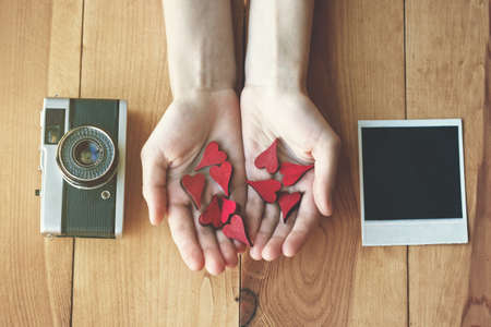 hand with hearts as like symbol in social media for pictures and photos