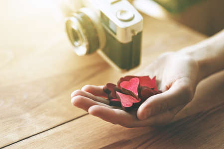 hand with hearts as like symbol in social media for pictures and photosの写真素材