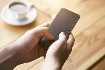 Hands using smart phone touching screen with fingers