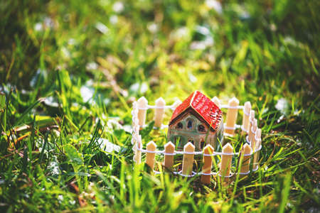 Model of house with fence. Safety, protection and private property conceptの写真素材