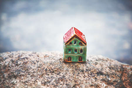 Model of ceramic house as symbolの写真素材