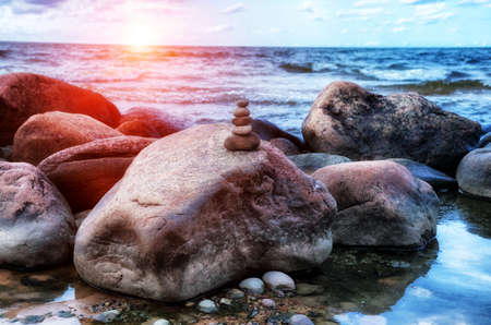 Sea pebble tower on stones. Balance and harmony conceptの写真素材