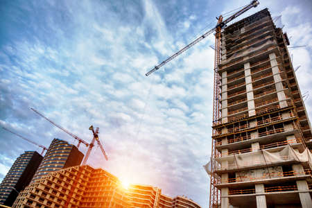 construction site with cranes and buildings