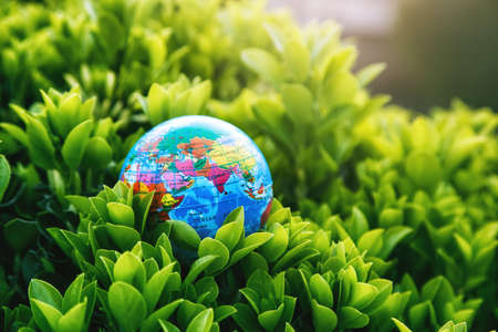 Planet earth model in green plants. Ecology, atmosphere and environment concept.の写真素材