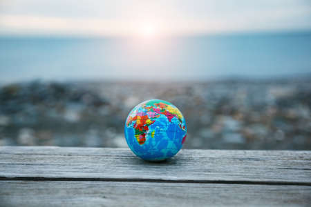 Earth planet model in sunrise or sunset lightの写真素材