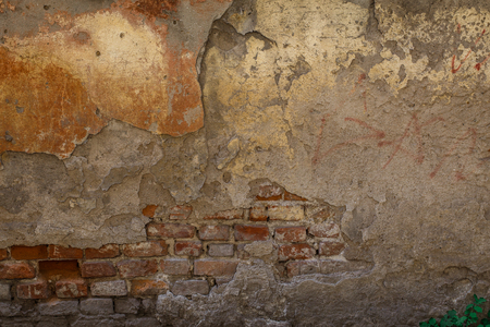 The old shabby brick wall with cracks background textureの写真素材