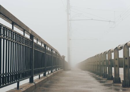 pavement of the bridge in the fog, the perspective