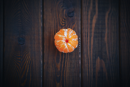 Mandarin or Tangerine Closeup on wooden background top viewの写真素材